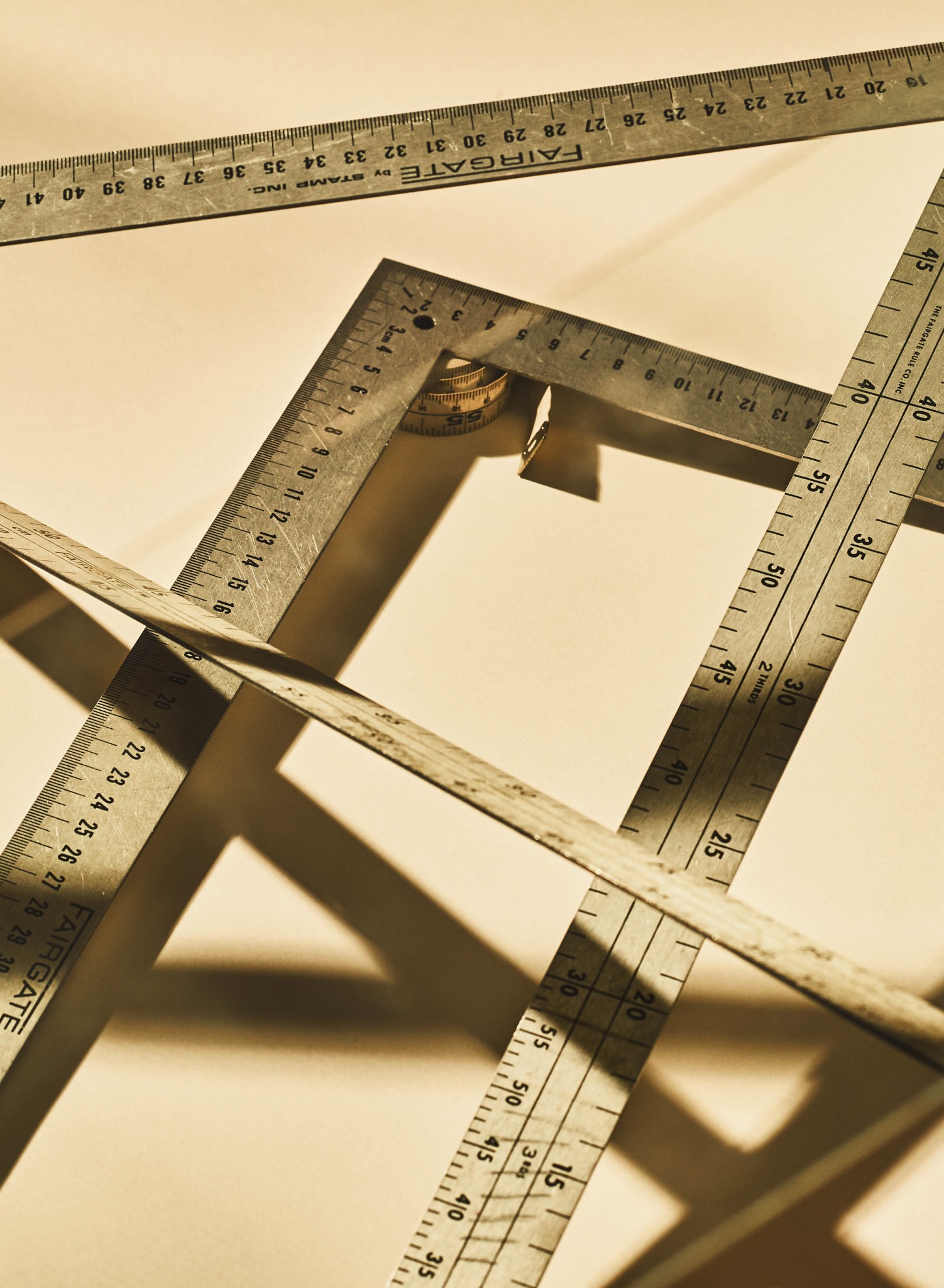 Closeup image of metal rulers and a tape measure