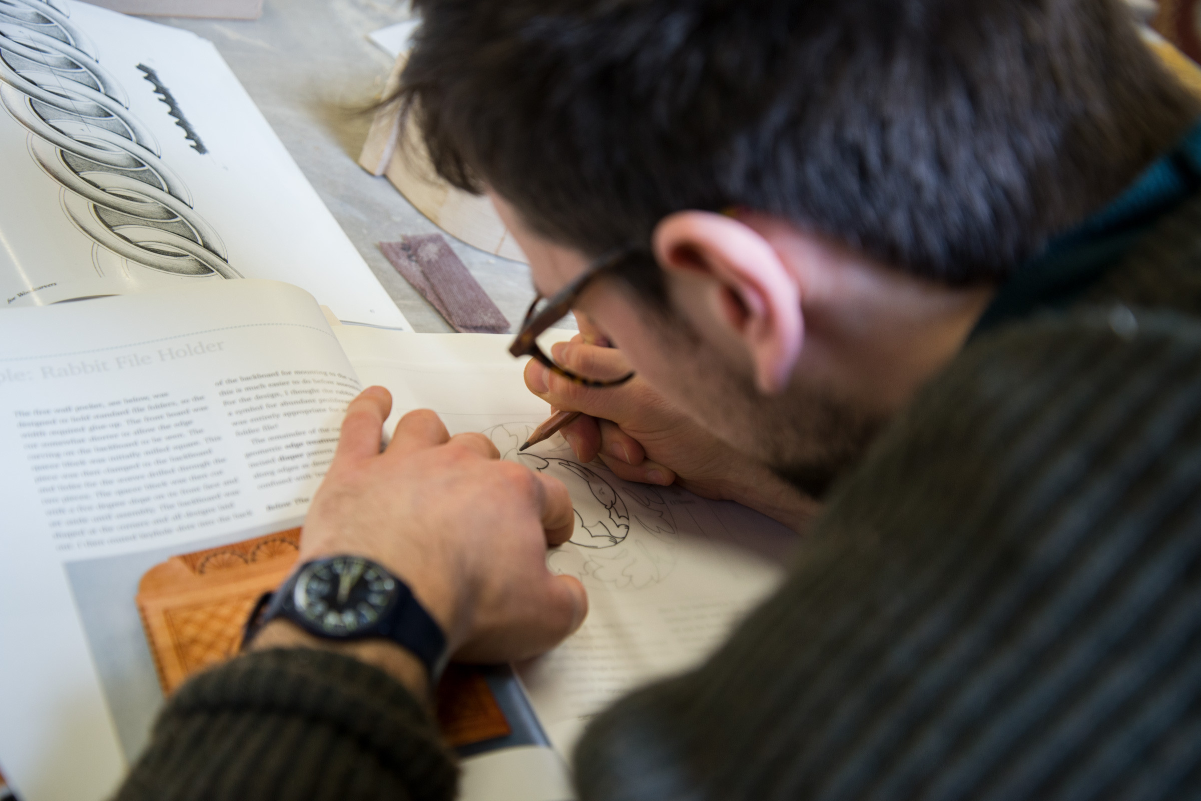 Close up image of a man drawing