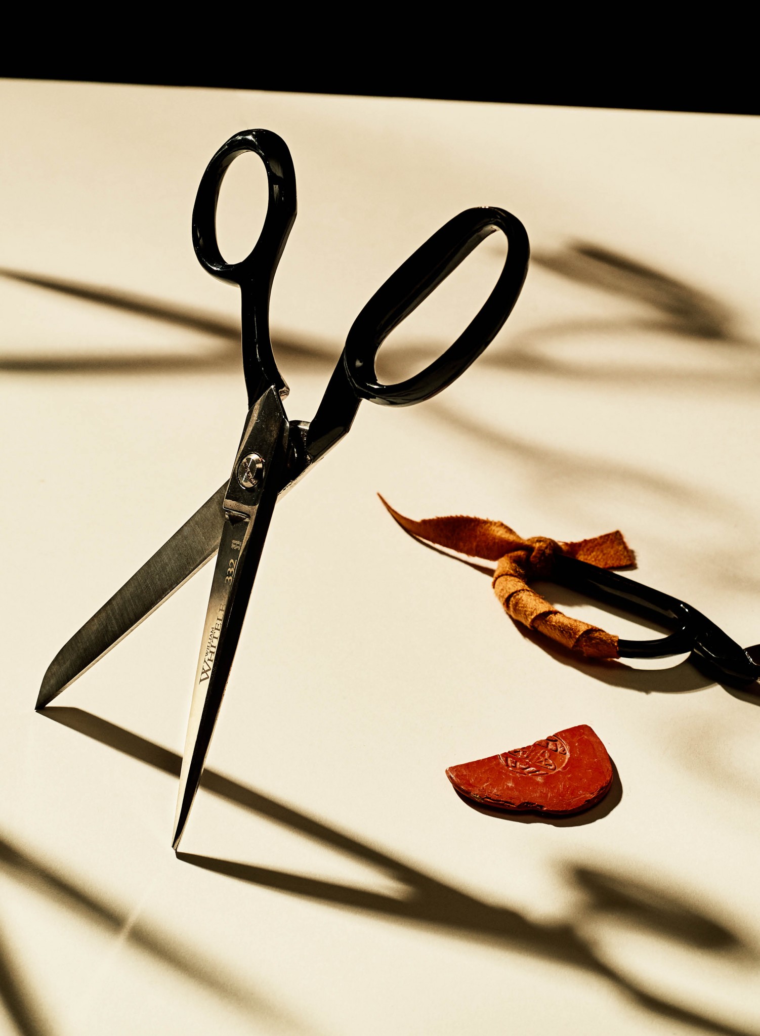 Closeup image of fabric scissors and tailor chalk