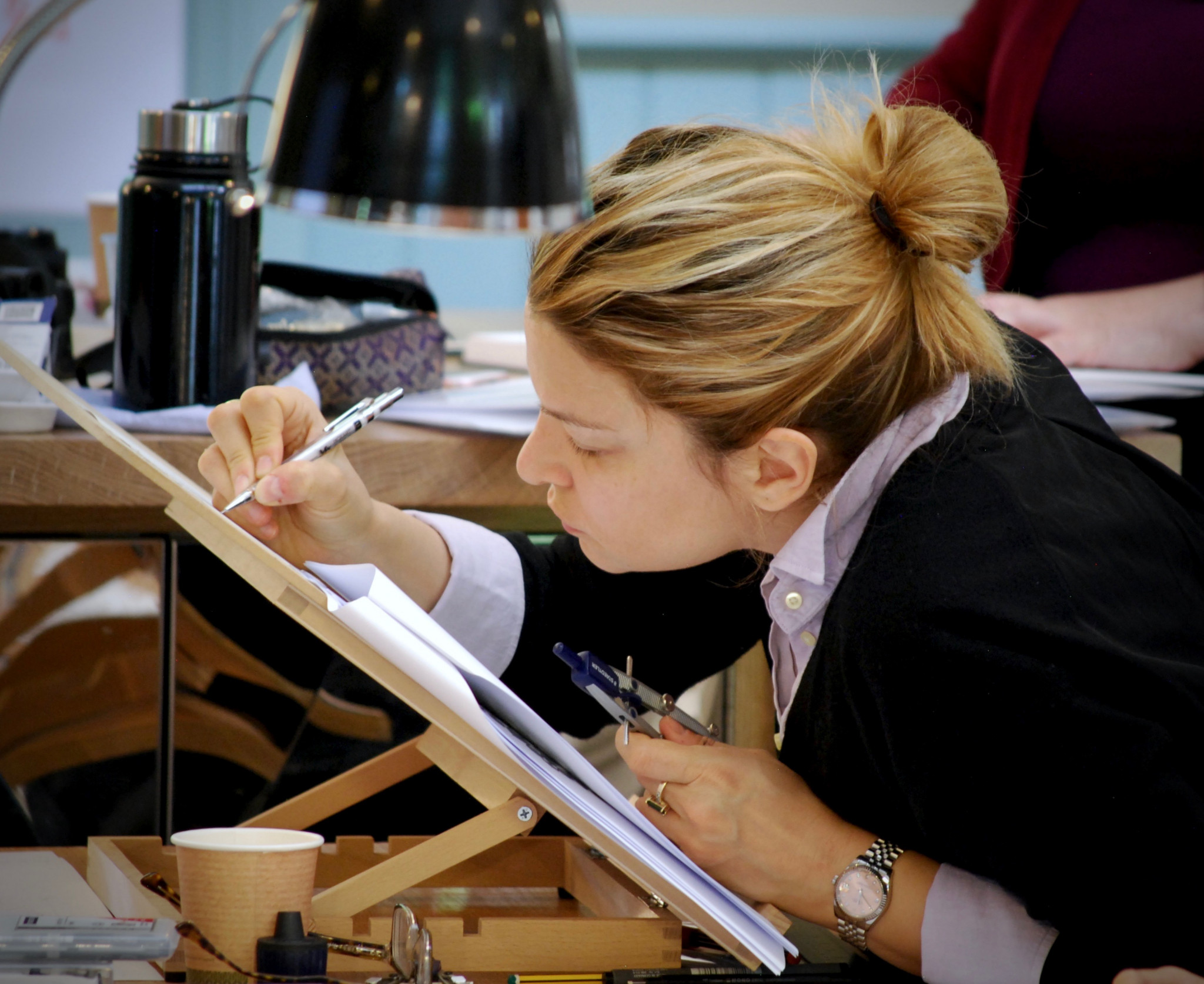 A photo of a woman drawing