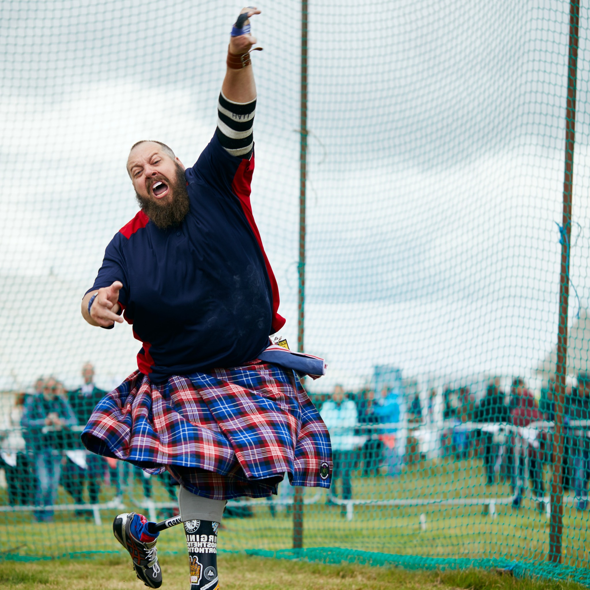 Image of Matthew Hall throwing a shot put