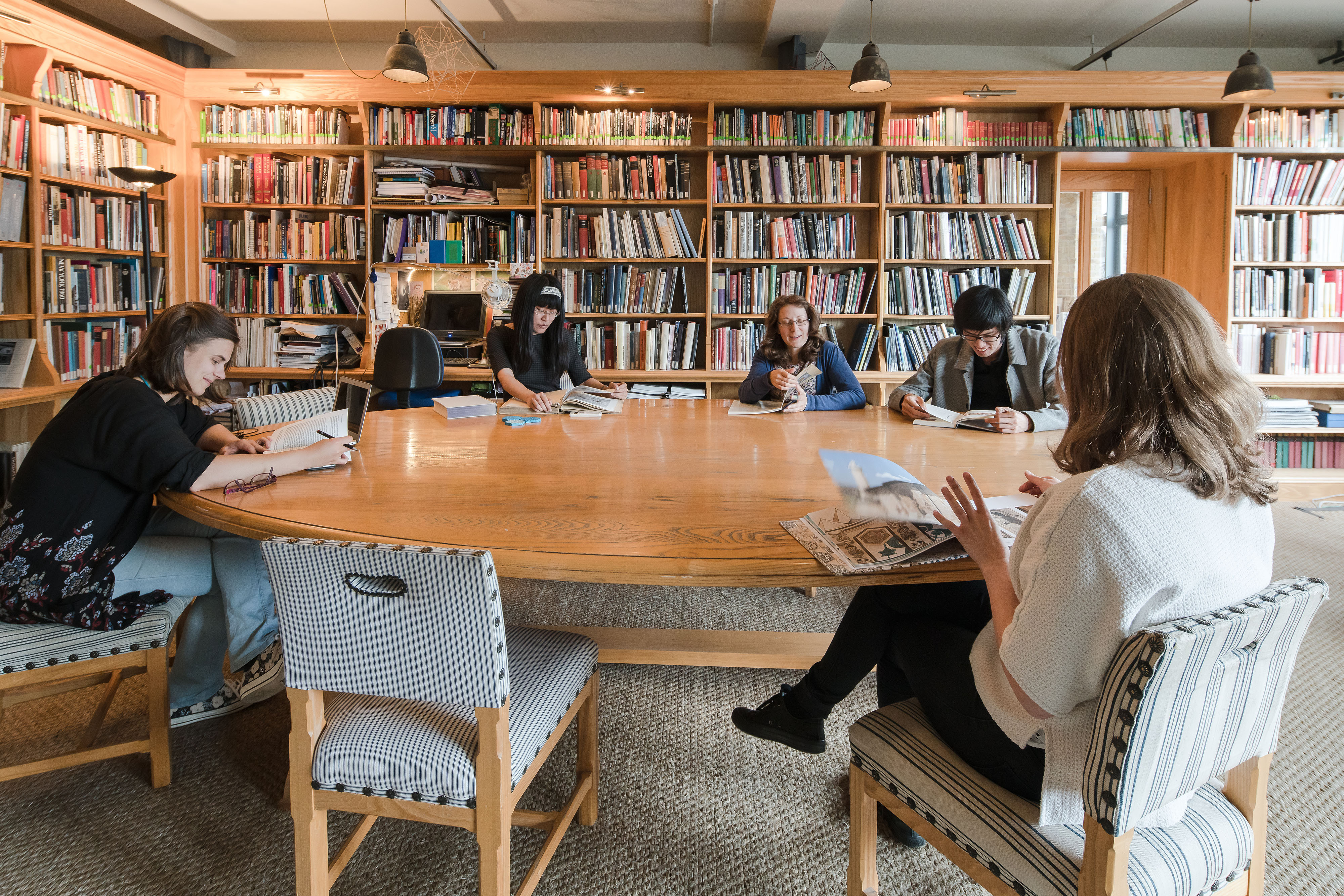 Image of people sitting around a table