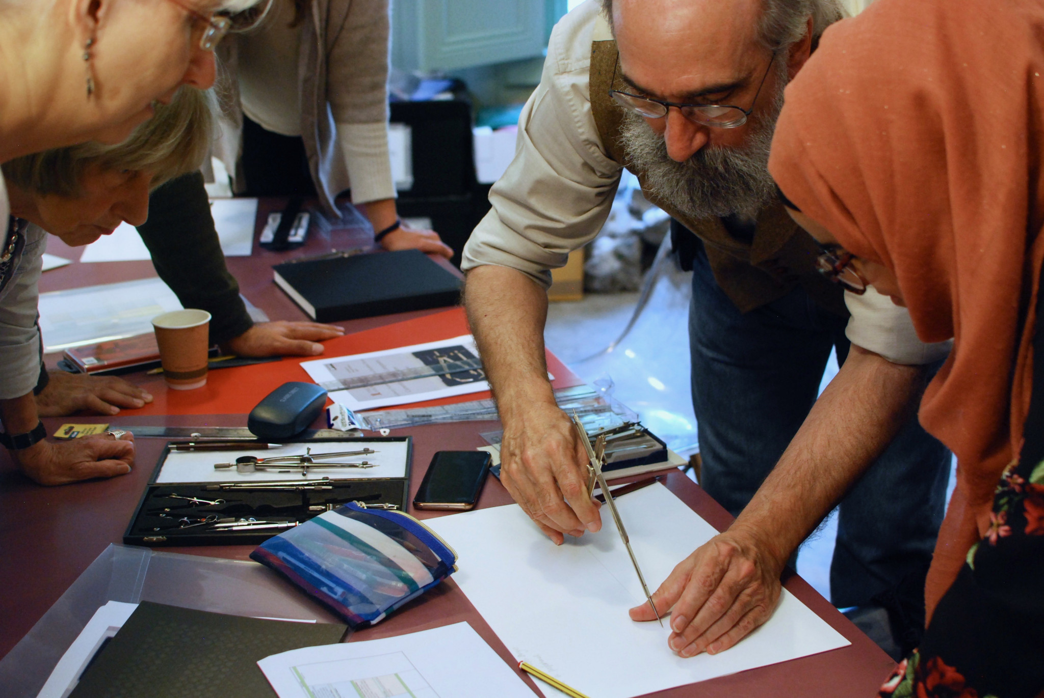 A photo of a tutor showing the students