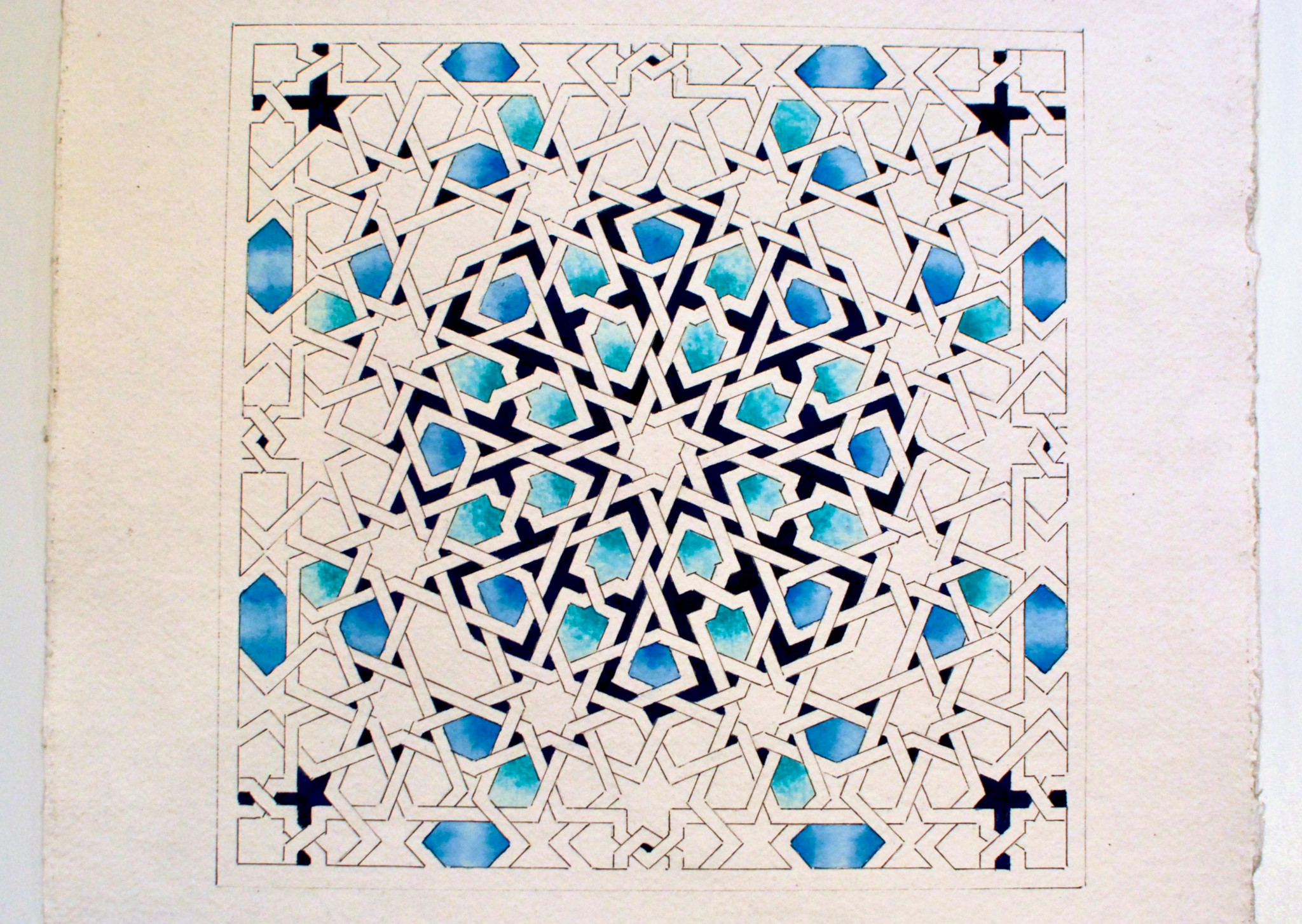 A photo of a geometric pattern in different shades of blue