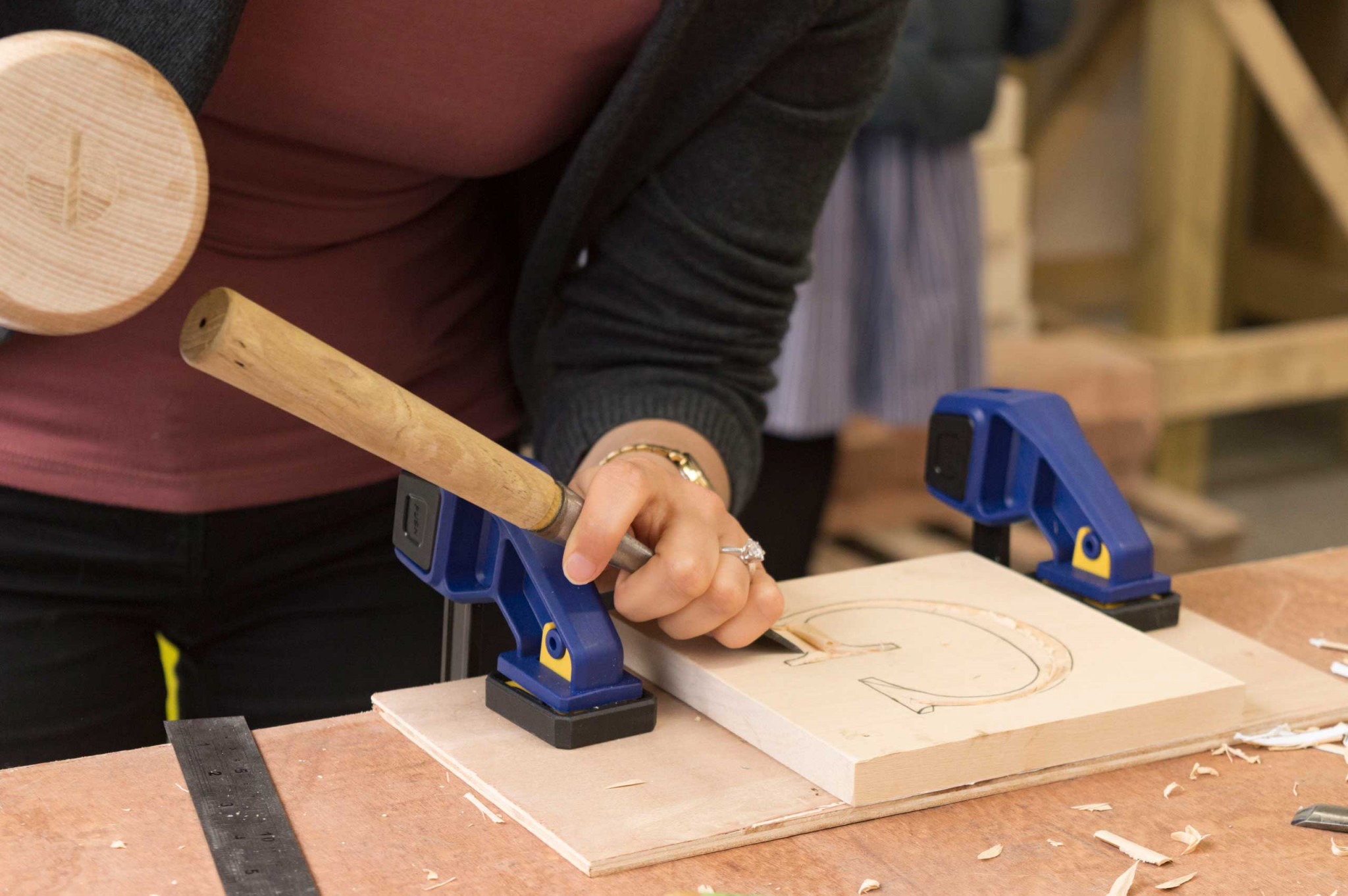 An image of Sarah Goss carving